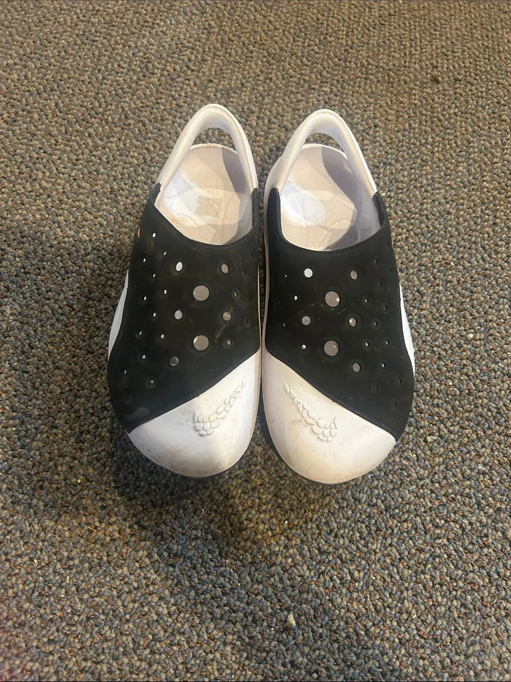 Nike Kids Black and White Slip-On Sandals with Orange Swoosh Accent